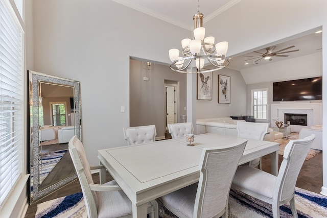 9709 Woodland Brook Ln S, Cordova, TN 38018 - dining room with wood finished floors, healthy amount of natural light, a fireplace, a chandelier, and ornamental molding