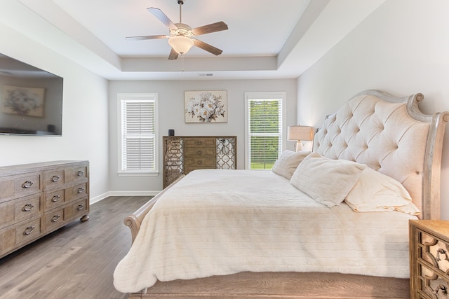 9709 Woodland Brook Ln S, Cordova, TN 38018 - bedroom with a tray ceiling, dark wood finished floors, baseboards, and ceiling fan