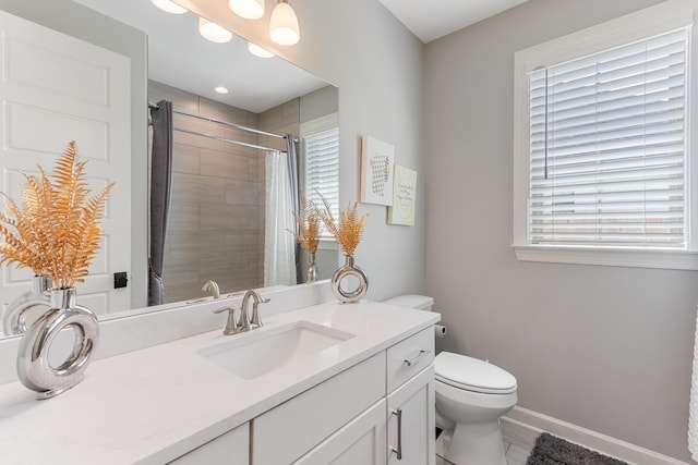 9709 Woodland Brook Ln S, Cordova, TN 38018 - bathroom featuring toilet, vanity, a shower with curtain, and baseboards