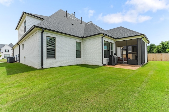 9709 Woodland Brook Ln S, Cordova, TN 38018 - rear view of property featuring a shingled roof, brick siding, and central AC unit