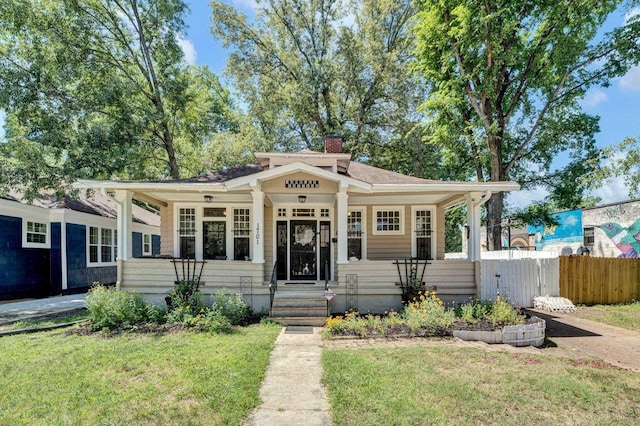 1701 Vesey Ave, Memphis, TN 38114 - bungalow-style house featuring a chimney and a porch