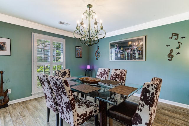 9040 Ashmere Dr, Germantown, TN 38139 - dining area featuring a chandelier, ornamental molding, baseboards, and light wood-style flooring