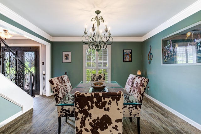 9040 Ashmere Dr, Germantown, TN 38139 - dining room featuring a chandelier, wood finished floors, baseboards, crown molding, and stairway