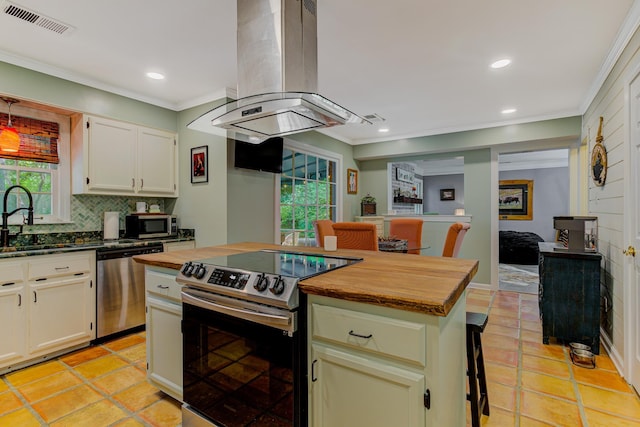 9040 Ashmere Dr, Germantown, TN 38139 - kitchen with stainless steel appliances, island range hood, a sink, decorative backsplash, and ornamental molding