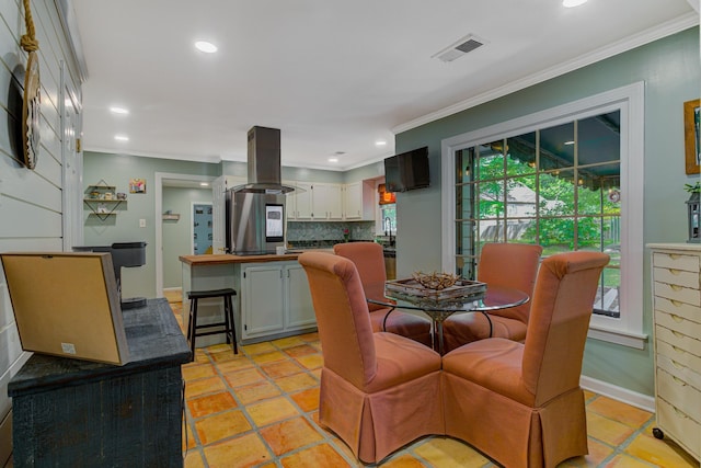 9040 Ashmere Dr, Germantown, TN 38139 - dining space with ornamental molding, plenty of natural light, and recessed lighting