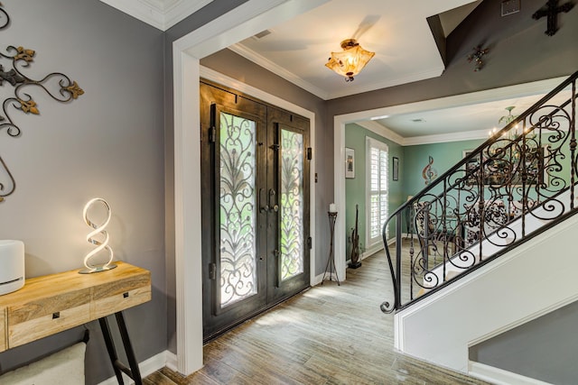 9040 Ashmere Dr, Germantown, TN 38139 - entryway with french doors, baseboards, wood finished floors, stairway, and ornamental molding