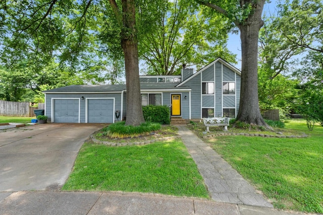 6814 Azalea Hill Cv, Bartlett, TN 38135 - view of front of home with a garage, driveway, and a chimney