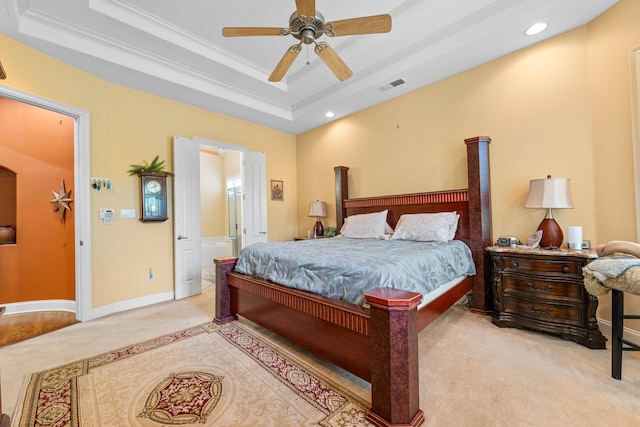 1073 Woodland Glen Dr, Cordova, TN 38018 - bedroom with a tray ceiling, light carpet, recessed lighting, ornamental molding, and connected bathroom