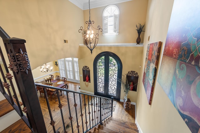 1073 Woodland Glen Dr, Cordova, TN 38018 - entryway featuring a chandelier, french doors, ornamental molding, hardwood / wood-style floors, and arched walkways