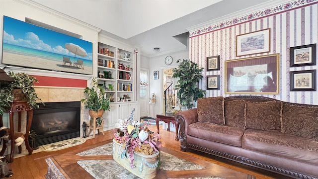 9573 Wolf River Blvd, Germantown, TN 38139 - living area with wood finished floors, a fireplace, built in shelves, and crown molding