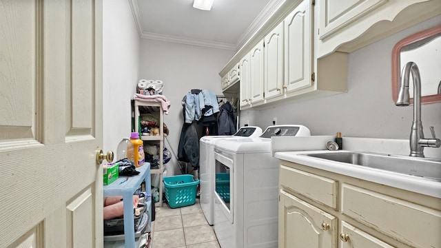 9573 Wolf River Blvd, Germantown, TN 38139 - laundry room featuring cabinet space, washer and dryer, crown molding, and light tile patterned floors