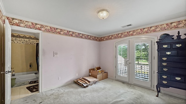 9573 Wolf River Blvd, Germantown, TN 38139 - unfurnished room featuring french doors, carpet flooring, arched walkways, crown molding, and baseboards