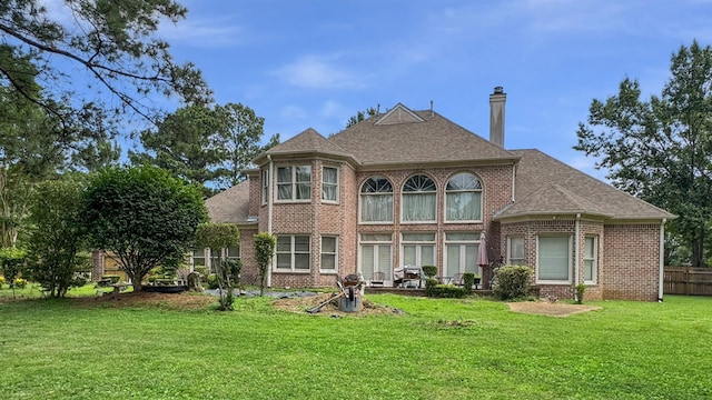 9573 Wolf River Blvd, Germantown, TN 38139 - rear view of house with brick siding, a chimney, and a shingled roof