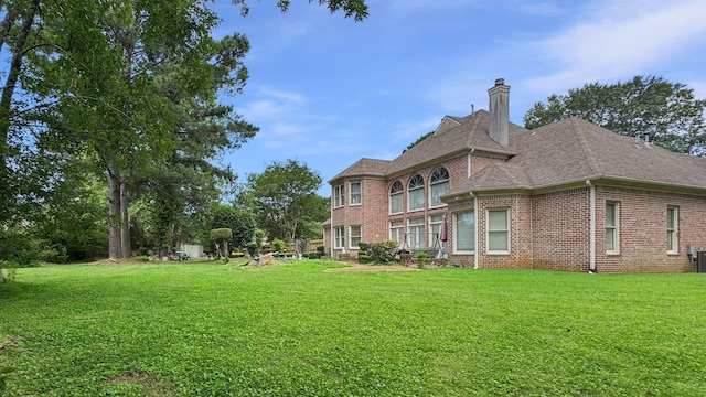 9573 Wolf River Blvd, Germantown, TN 38139 - view of grassy yard with central AC