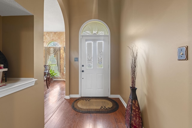 1103 Green Fern Cv, Cordova, TN 38018 - entrance foyer with hardwood / wood-style flooring, baseboards, and arched walkways