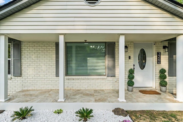 3266 Dothan St, Memphis, TN 38118 - property entrance featuring brick siding and a porch