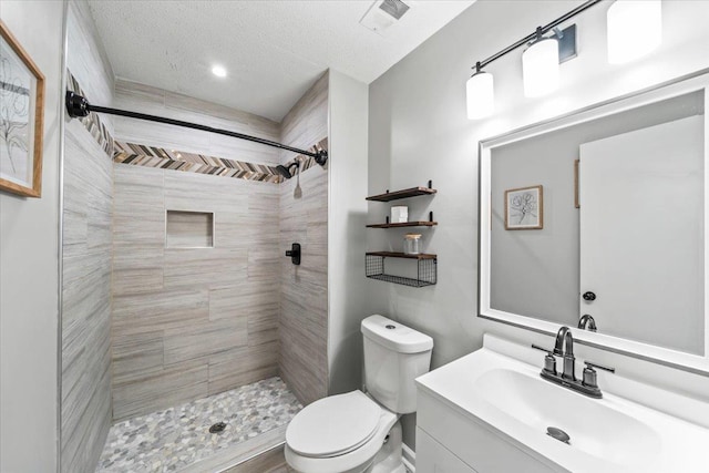 3266 Dothan St, Memphis, TN 38118 - bathroom featuring toilet, vanity, a stall shower, and recessed lighting
