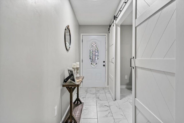 3266 Dothan St, Memphis, TN 38118 - entrance foyer featuring a barn door, light marble finish flooring, and baseboards