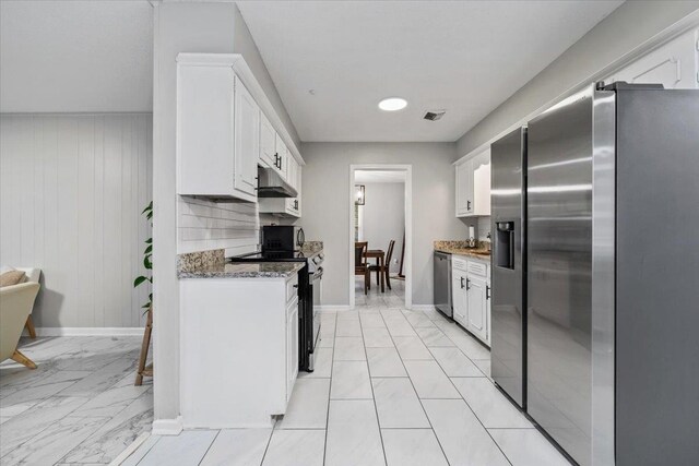 3266 Dothan St, Memphis, TN 38118 - kitchen with appliances with stainless steel finishes, under cabinet range hood, white cabinets, baseboards, and light marble finish flooring