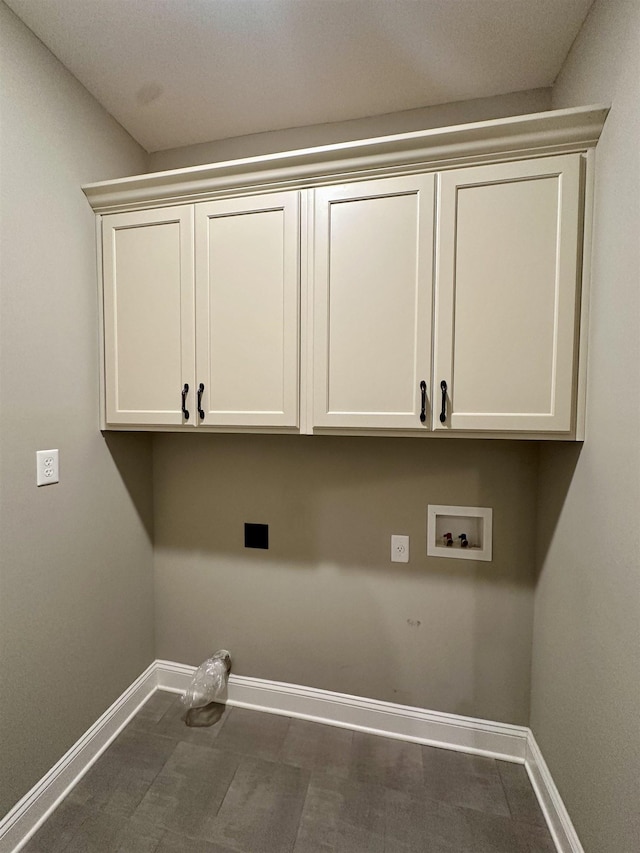 4049 Courtyard Dr, Southaven, MS 38672 - laundry area with baseboards, cabinet space, and hookup for a washing machine