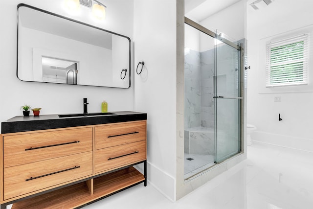 1721 Nelson Ave, Memphis, TN 38114 - bathroom featuring vanity, a marble finish shower, toilet, and baseboards