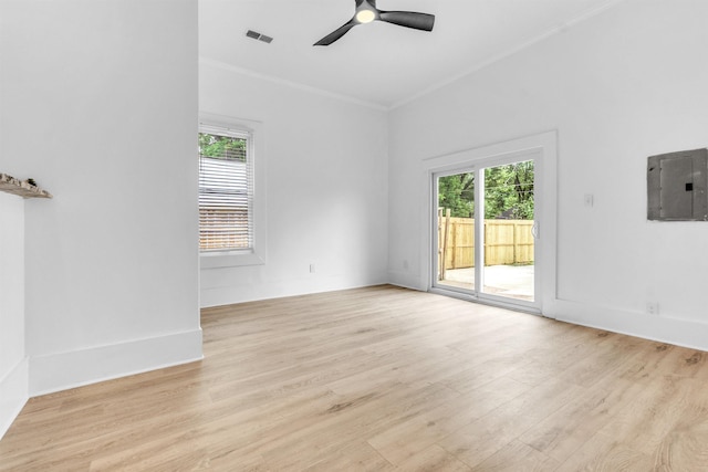 1721 Nelson Ave, Memphis, TN 38114 - spare room with electric panel, plenty of natural light, ornamental molding, light wood finished floors, and ceiling fan