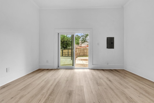 1721 Nelson Ave, Memphis, TN 38114 - spare room with electric panel, light wood-style flooring, crown molding, and baseboards
