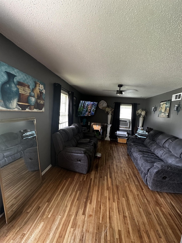 179 Appleton Ave, Memphis, TN 38109 - living area with a textured ceiling, wood finished floors, and ceiling fan