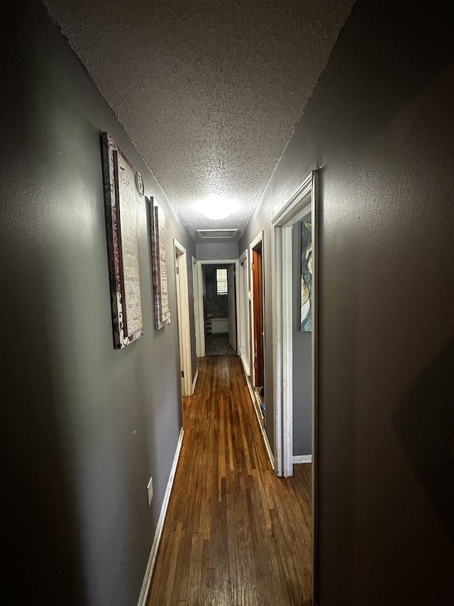179 Appleton Ave, Memphis, TN 38109 - corridor featuring a textured ceiling, wood finished floors, and baseboards