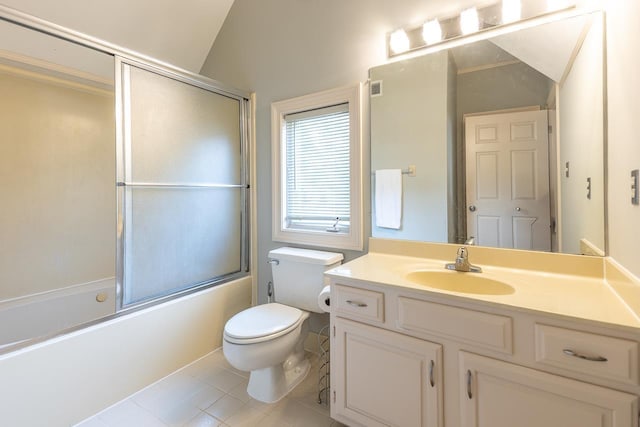 1570 Eastmoreland Ave, Memphis, TN 38104 - full bath with vanity, tile patterned flooring, toilet, shower / bath combination with glass door, and lofted ceiling