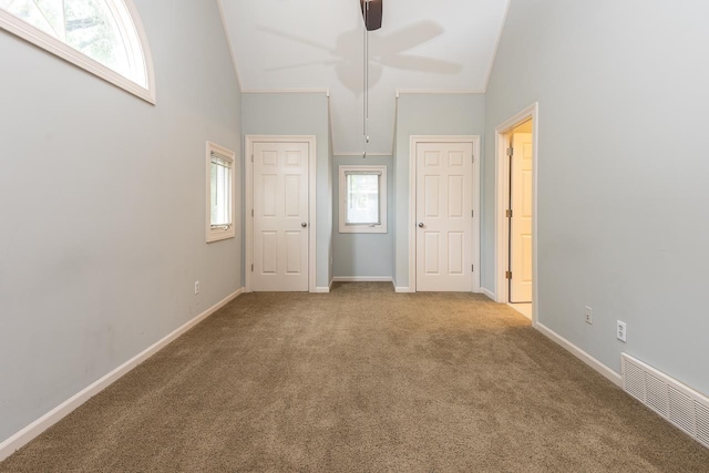 1570 Eastmoreland Ave, Memphis, TN 38104 - unfurnished bedroom with carpet floors, vaulted ceiling, and baseboards