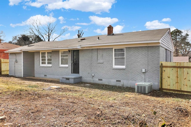 3314 Frayser View Dr, Memphis, TN 38127 - back of property featuring crawl space, brick siding, a chimney, and central AC