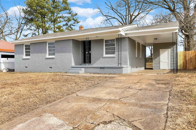 3314 Frayser View Dr, Memphis, TN 38127 - view of front of home with brick siding, driveway, an attached carport, a chimney, and crawl space
