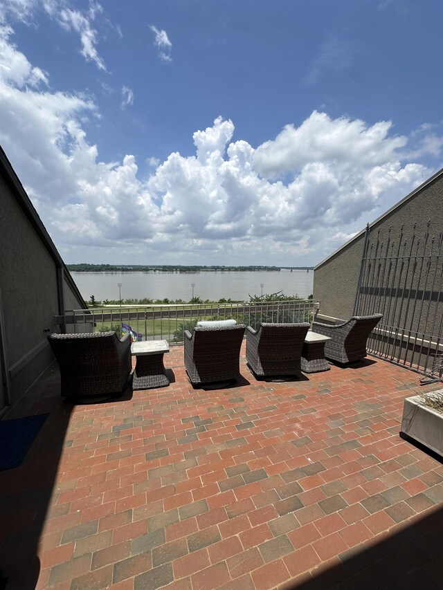 373 Riverbluff Pl Unit 3, Memphis, TN 38103 - view of patio with a water view, an outdoor living space, and a balcony