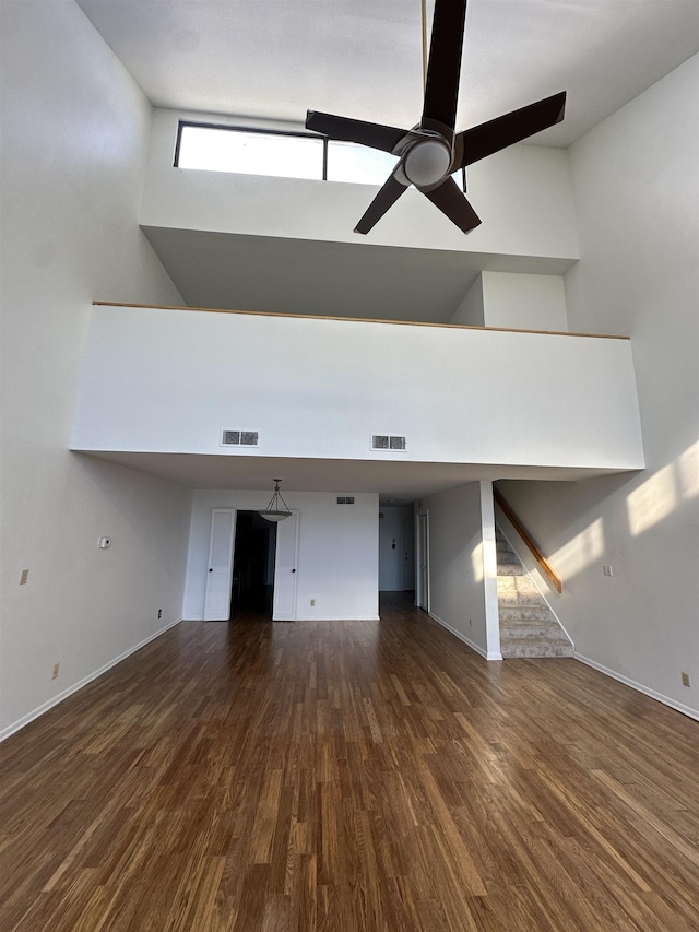 373 Riverbluff Pl Unit 3, Memphis, TN 38103 - unfurnished living room featuring high vaulted ceiling, a ceiling fan, wood finished floors, and baseboards