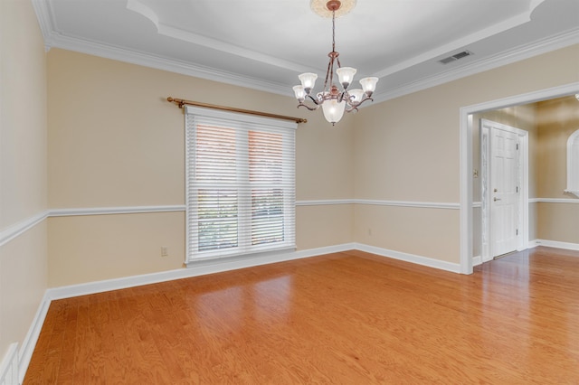 2660 Dibrell Trail Dr, Collierville, TN 38017 - spare room with a tray ceiling, light wood-style flooring, a chandelier, crown molding, and baseboards