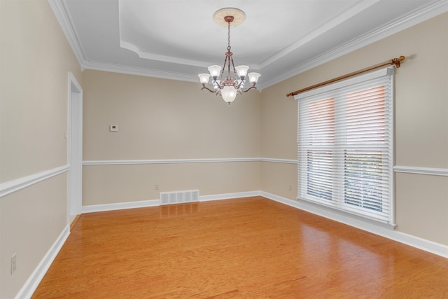 2660 Dibrell Trail Dr, Collierville, TN 38017 - empty room with wood finished floors, a chandelier, ornamental molding, a raised ceiling, and baseboards