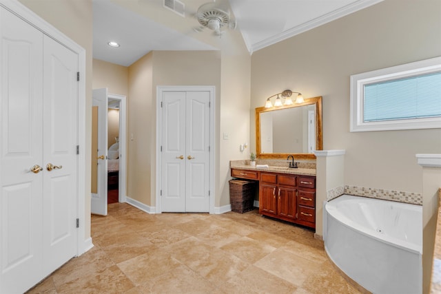 2660 Dibrell Trail Dr, Collierville, TN 38017 - bathroom with vanity, a closet, a garden tub, ceiling fan, and crown molding