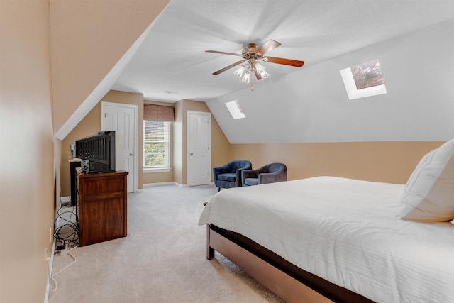 2660 Dibrell Trail Dr, Collierville, TN 38017 - carpeted bedroom with a skylight, vaulted ceiling, baseboards, and ceiling fan