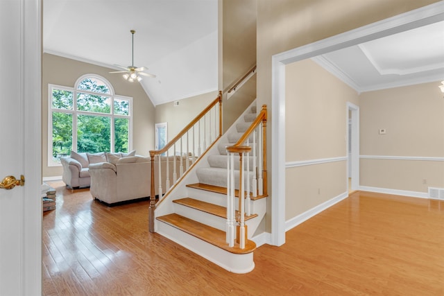 2660 Dibrell Trail Dr, Collierville, TN 38017 - stairway with a ceiling fan, wood finished floors, crown molding, baseboards, and vaulted ceiling
