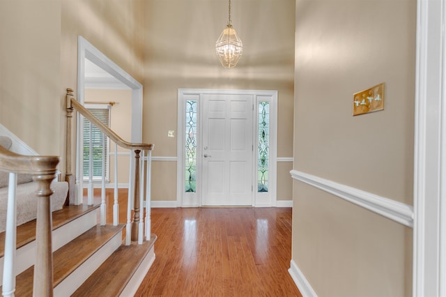 2660 Dibrell Trail Dr, Collierville, TN 38017 - entryway featuring stairway, a chandelier, wood finished floors, and baseboards