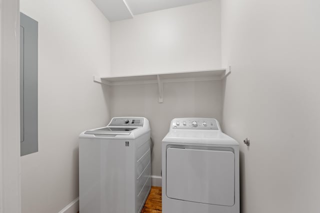 123 Court Ave Unit 401, Memphis, TN 38103 - laundry room featuring washer and dryer and wood finished floors