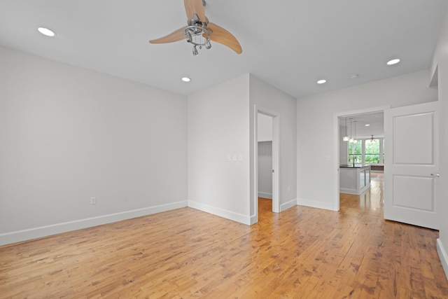 123 Court Ave Unit 401, Memphis, TN 38103 - empty room featuring light wood-style flooring, ceiling fan, recessed lighting, and baseboards