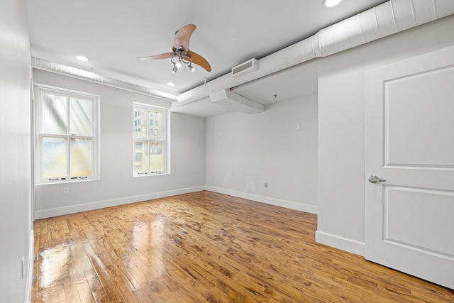 123 Court Ave Unit 401, Memphis, TN 38103 - spare room featuring recessed lighting, light wood-type flooring, a ceiling fan, and baseboards