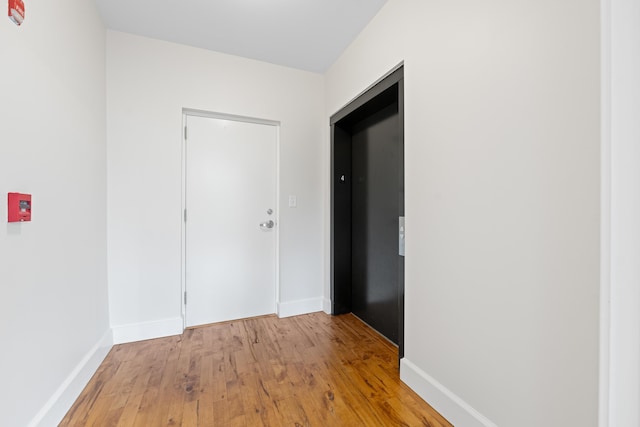 123 Court Ave Unit 401, Memphis, TN 38103 - hallway featuring light wood finished floors and baseboards