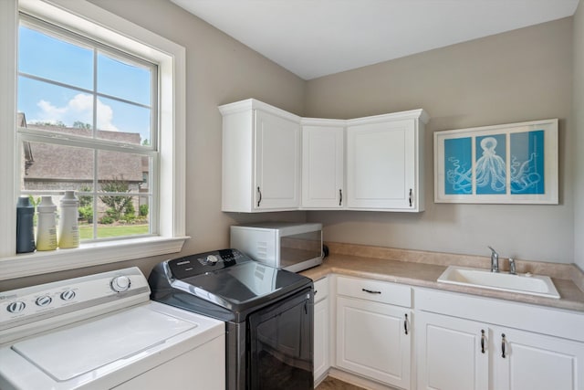 125 Mallard Ln, Rossville, TN 38066 - laundry room with cabinet space and washer and clothes dryer