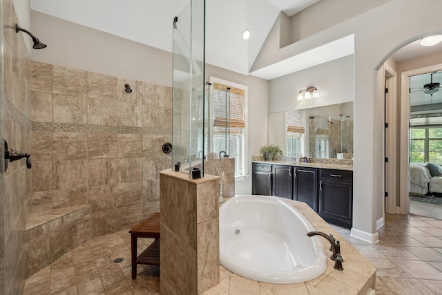 125 Mallard Ln, Rossville, TN 38066 - bathroom featuring walk in shower, a jetted tub, vaulted ceiling, vanity, and ensuite bath