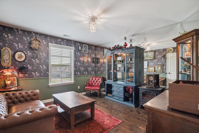 125 Mallard Ln, Rossville, TN 38066 - living area with wallpapered walls, hardwood / wood-style flooring, a wood stove, and baseboards