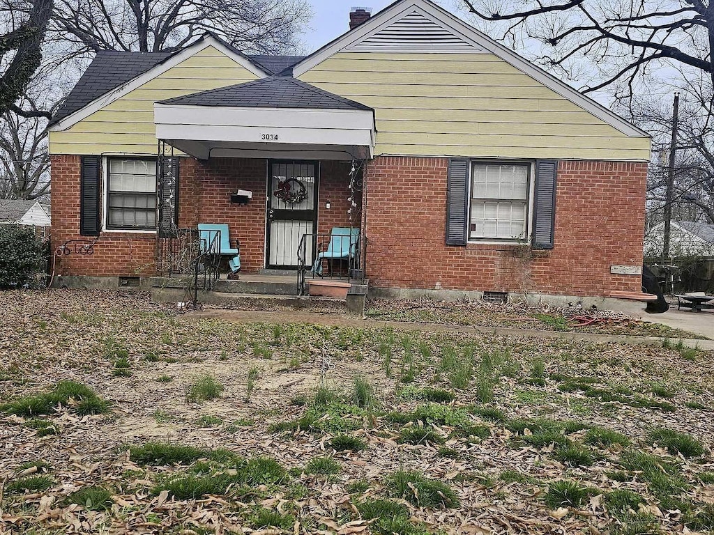 3034 Mccool Ave, Memphis, TN 38114 - view of front of home featuring brick siding and a chimney
