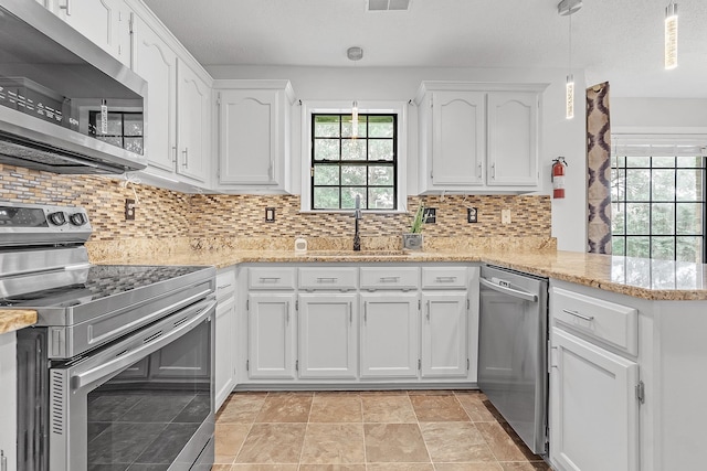 4788 Shadow View Ln, Bartlett, TN 38002 - kitchen with appliances with stainless steel finishes, a sink, white cabinetry, a peninsula, and light stone counters